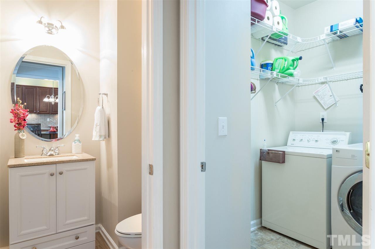 7718 Tori Trace Raleigh, NC 27613 - Photo 15 of 30 1st floor laundry with lots of storage