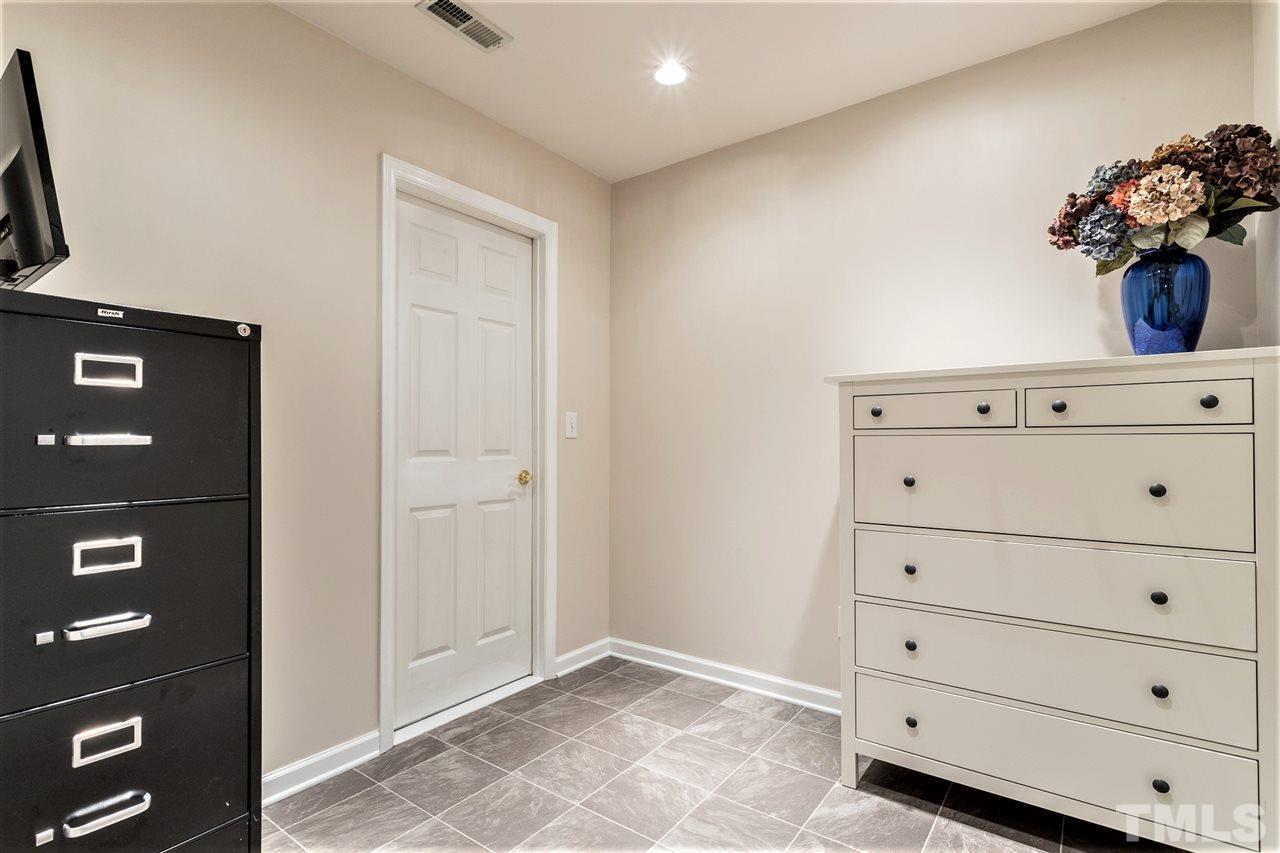 7718 Tori Trace Raleigh, NC 27613 - Photo 22 of 30 Owner converted part of storage area to office. Included in square footage but not permitted.