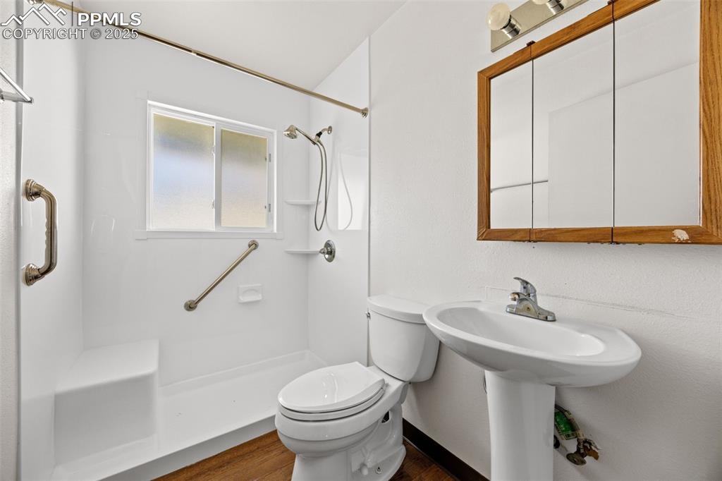 2131 Preuss Road, Unit A Colorado Springs, CO 80910 - Photo 12 of 17 a bathroom with a sink toilet and shower