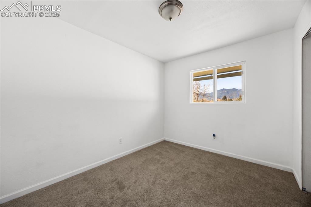 2131 Preuss Road, Unit A Colorado Springs, CO 80910 - Photo 13 of 17 an empty room with a window