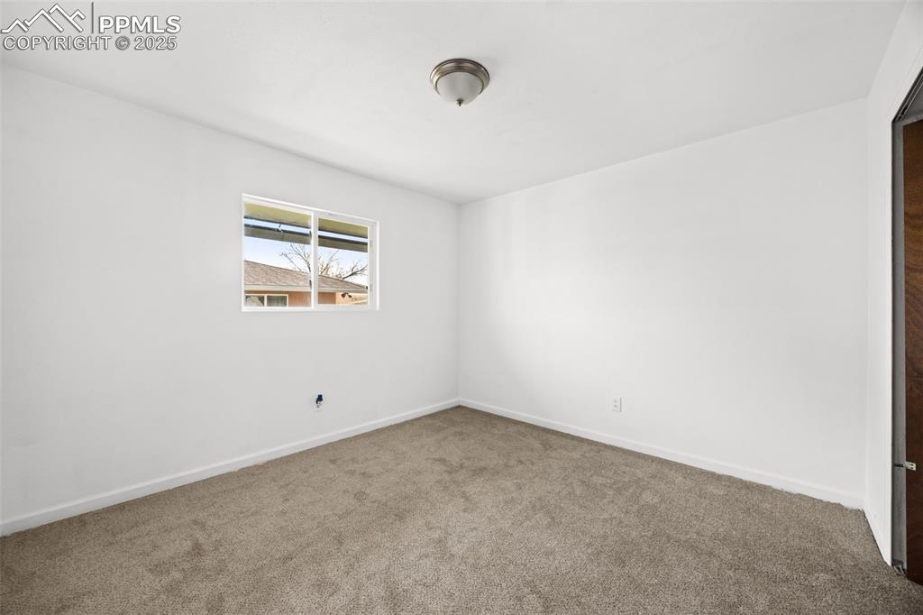 2131 Preuss Road, Unit A Colorado Springs, CO 80910 - Photo 15 of 17 an empty room with windows