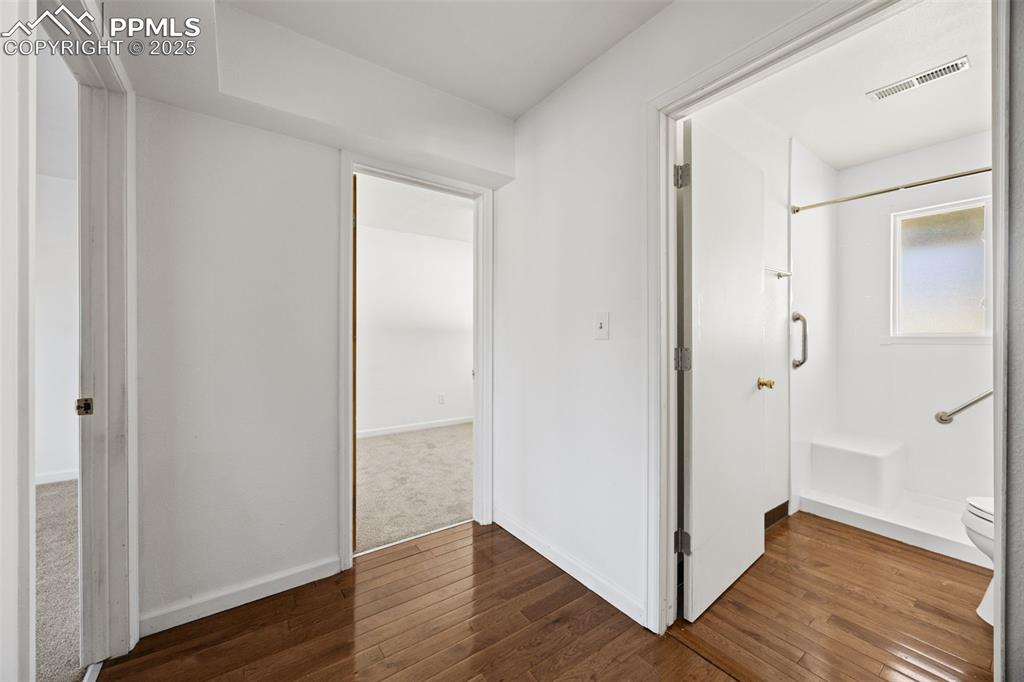 2131 Preuss Road, Unit A Colorado Springs, CO 80910 - Photo 16 of 17 a view of an empty room with wooden floor