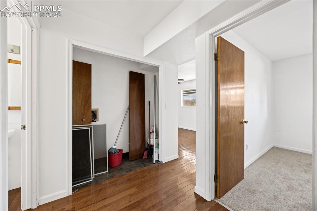 2131 Preuss Road, Unit A Colorado Springs, CO 80910 - Photo 17 of 17 a view of a hallway with wooden floor and closet