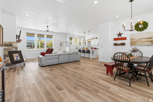 886 North 300th East Spring City, UT 84662 - Photo 10 of 40 Dining area featuring light wood-type flooring, suspended lighting, and a ceiling fan
