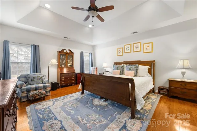 a bedroom with a bed couch and a window