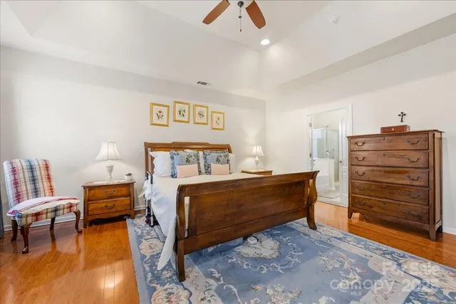 a bed room with a bed and a chair