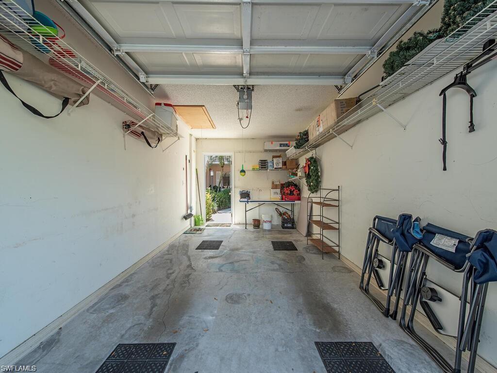 5932 Cranbrook Way, Unit C106 Naples, FL 34112 - Photo 13 of 13 Garage with baseboards