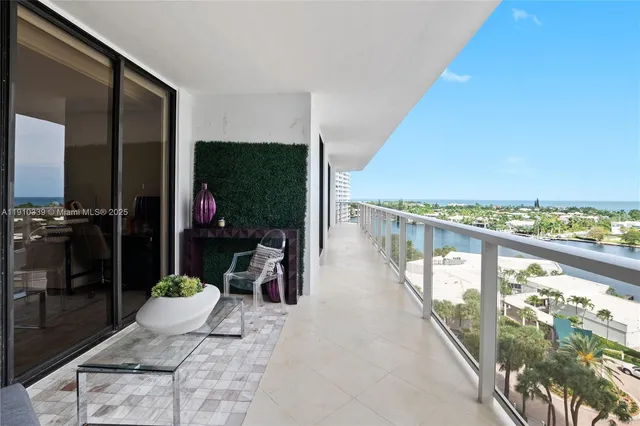 a view of a kitchen with kitchen island stainless steel appliances wooden floor dining table and chairs