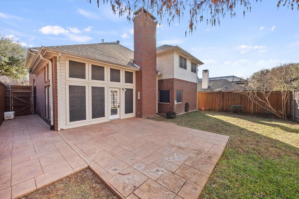 14633 Lakecrest Drive Addison, TX 75001 - Photo 13 of 14 a view of a house with backyard and trees