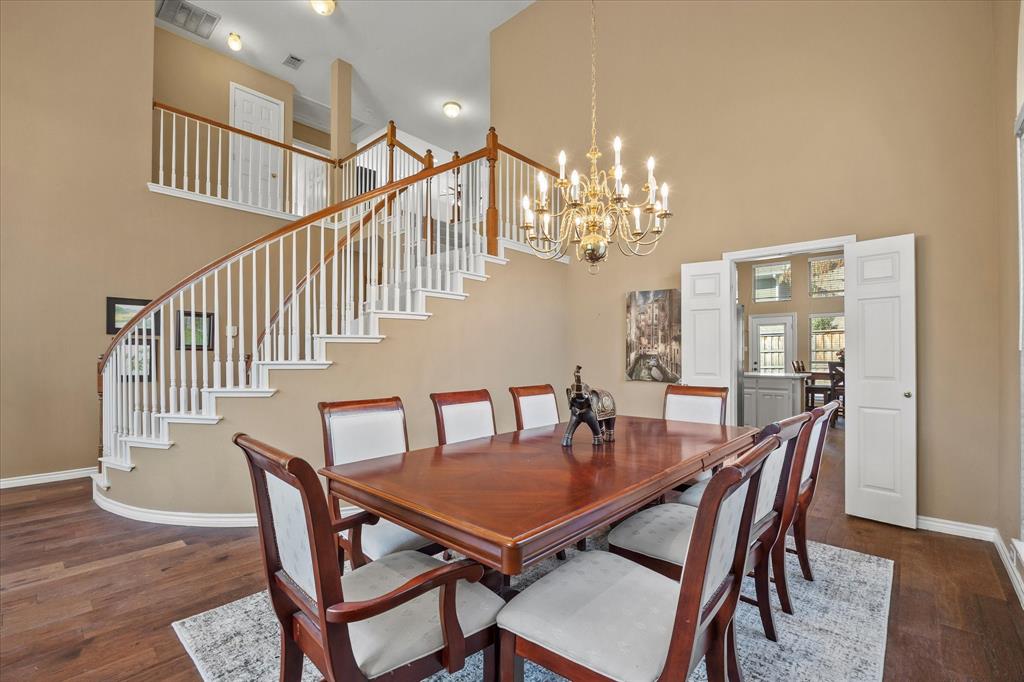 14633 Lakecrest Drive Addison, TX 75001 - Photo 3 of 14 a view of a dining room with furniture and wooden floor