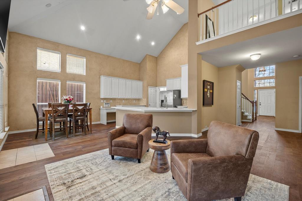 14633 Lakecrest Drive Addison, TX 75001 - Photo 6 of 14 a living room with furniture wooden floor and a view of kitchen