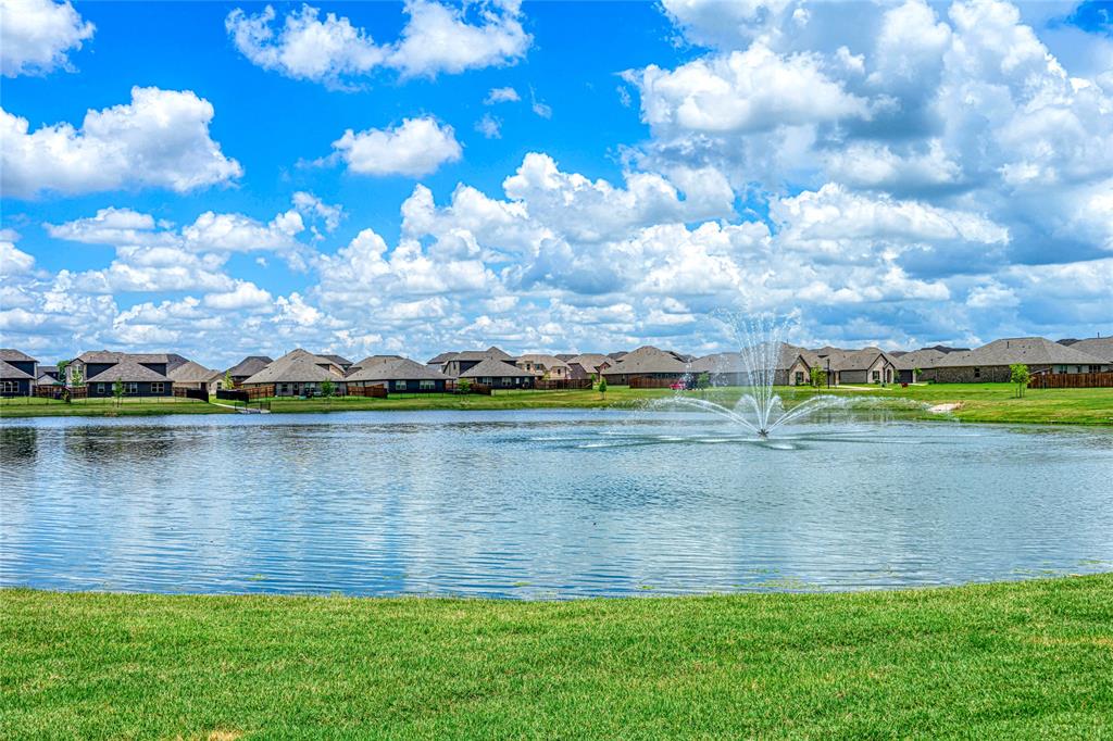 610 Ridgewood Drive Van Alstyne, TX 75495 - Photo 33 of 34 a view of a lake with houses in the back