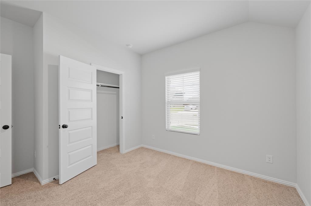 610 Ridgewood Drive Van Alstyne, TX 75495 - Photo 8 of 34 an empty room with windows