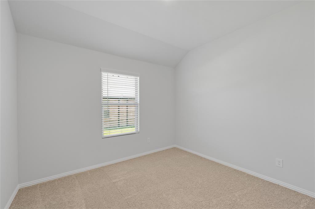 610 Ridgewood Drive Van Alstyne, TX 75495 - Photo 10 of 34 an empty room with a window
