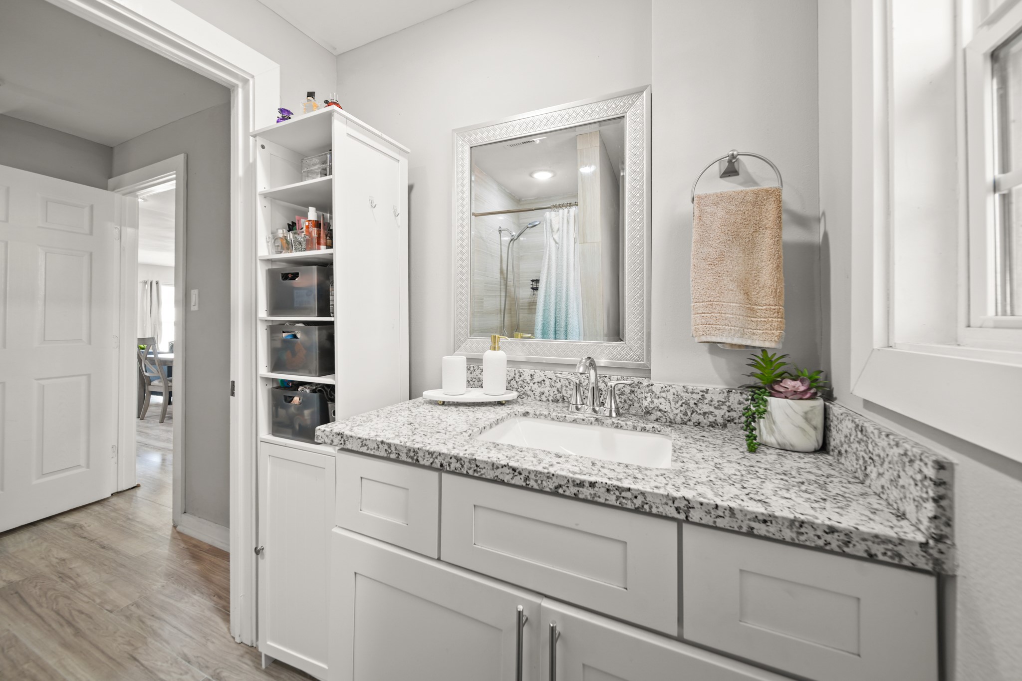 5605 Colfax Street Houston, TX 77020 - Photo 11 of 21 a bathroom with a granite countertop sink and a mirror