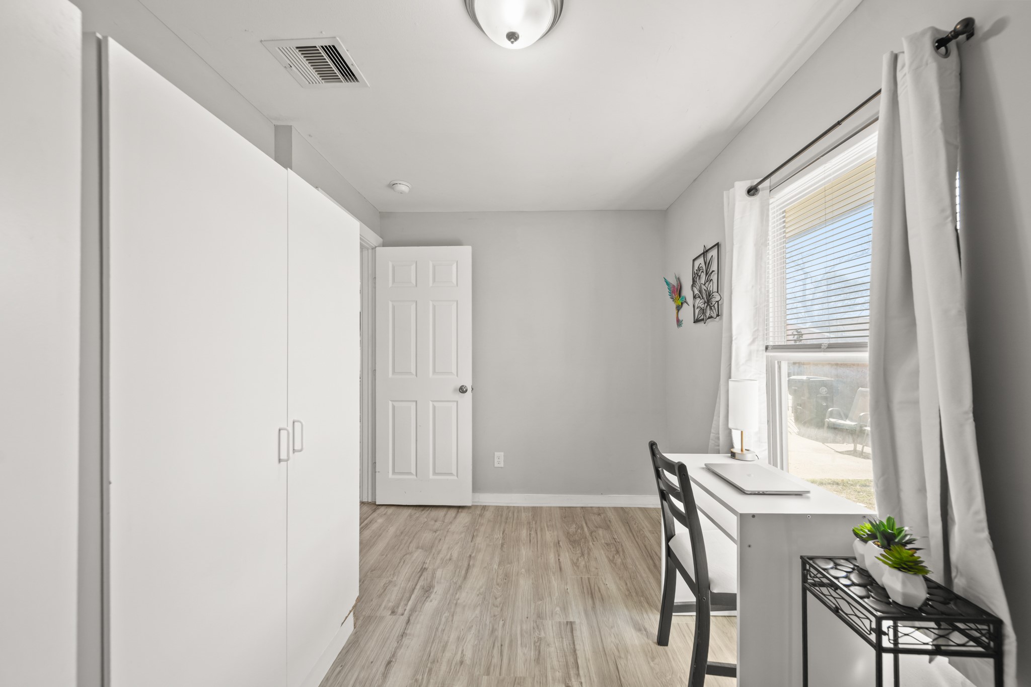 5605 Colfax Street Houston, TX 77020 - Photo 15 of 21 a view of a livingroom with furniture and wooden floor