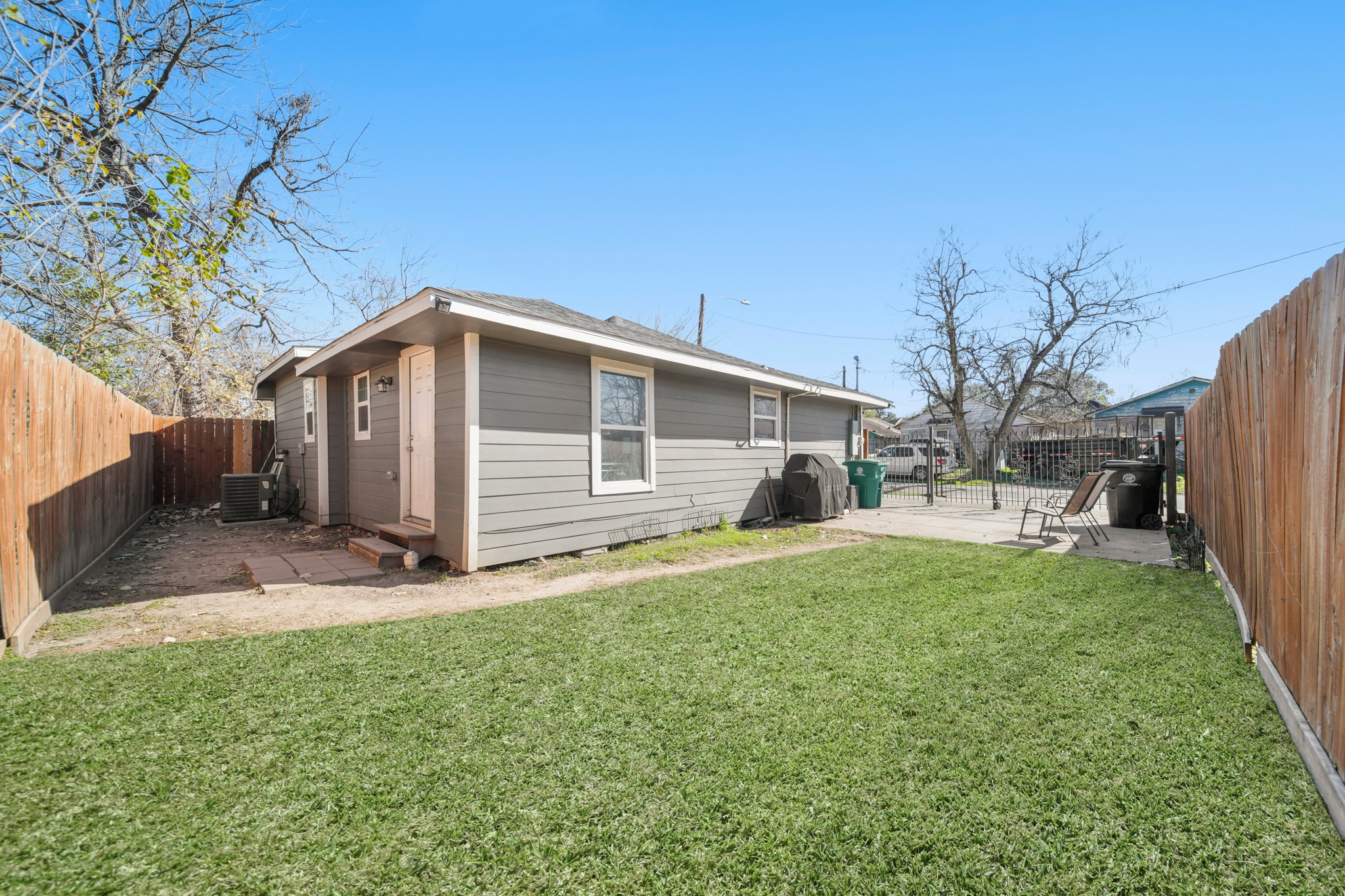 5605 Colfax Street Houston, TX 77020 - Photo 19 of 21 a front view of house with yard and trees in the background