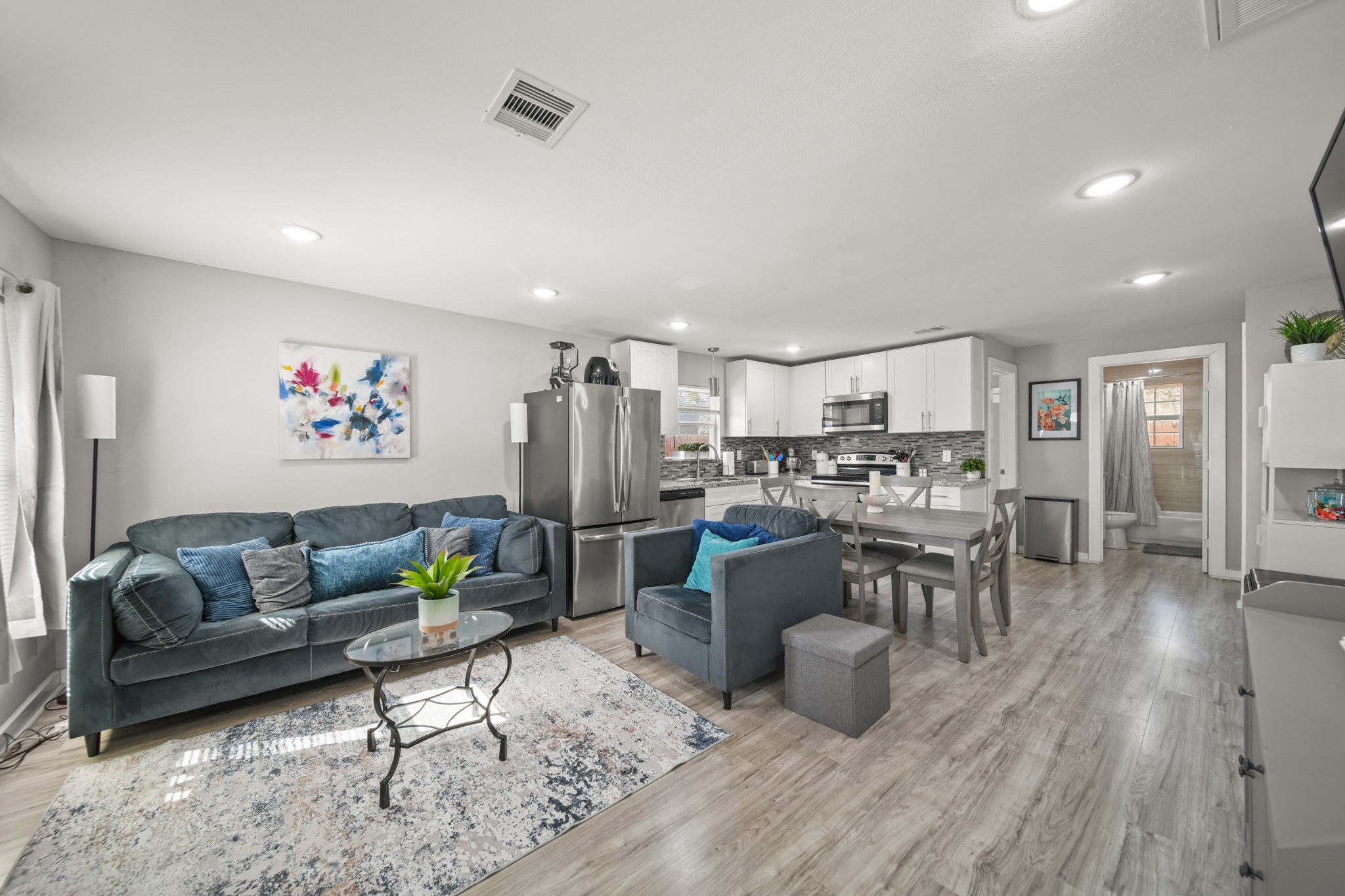 5605 Colfax Street Houston, TX 77020 - Photo 2 of 21 a living room with lots of furniture and kitchen view