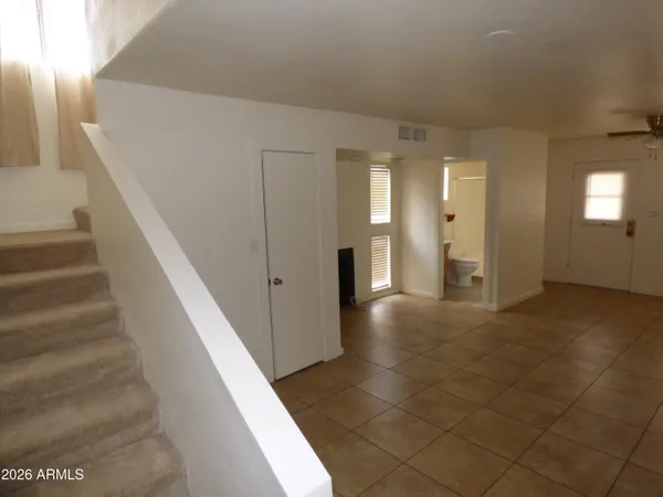 a view of a hallway with staircase