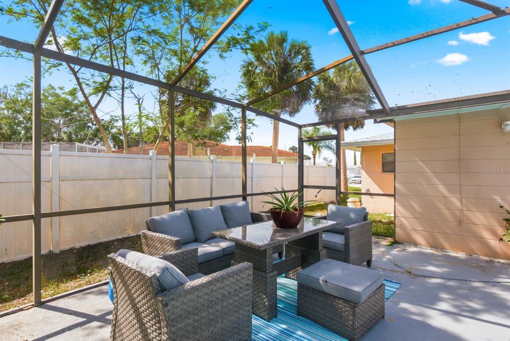 4276 Rudder Way New Port Richey, FL 34652 - Photo 22 of 29 a building outdoor space with patio furniture