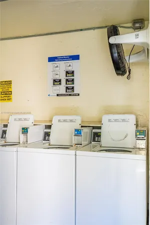 a kitchen with a refrigerator and a sink