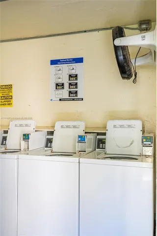 a kitchen with a refrigerator and a sink
