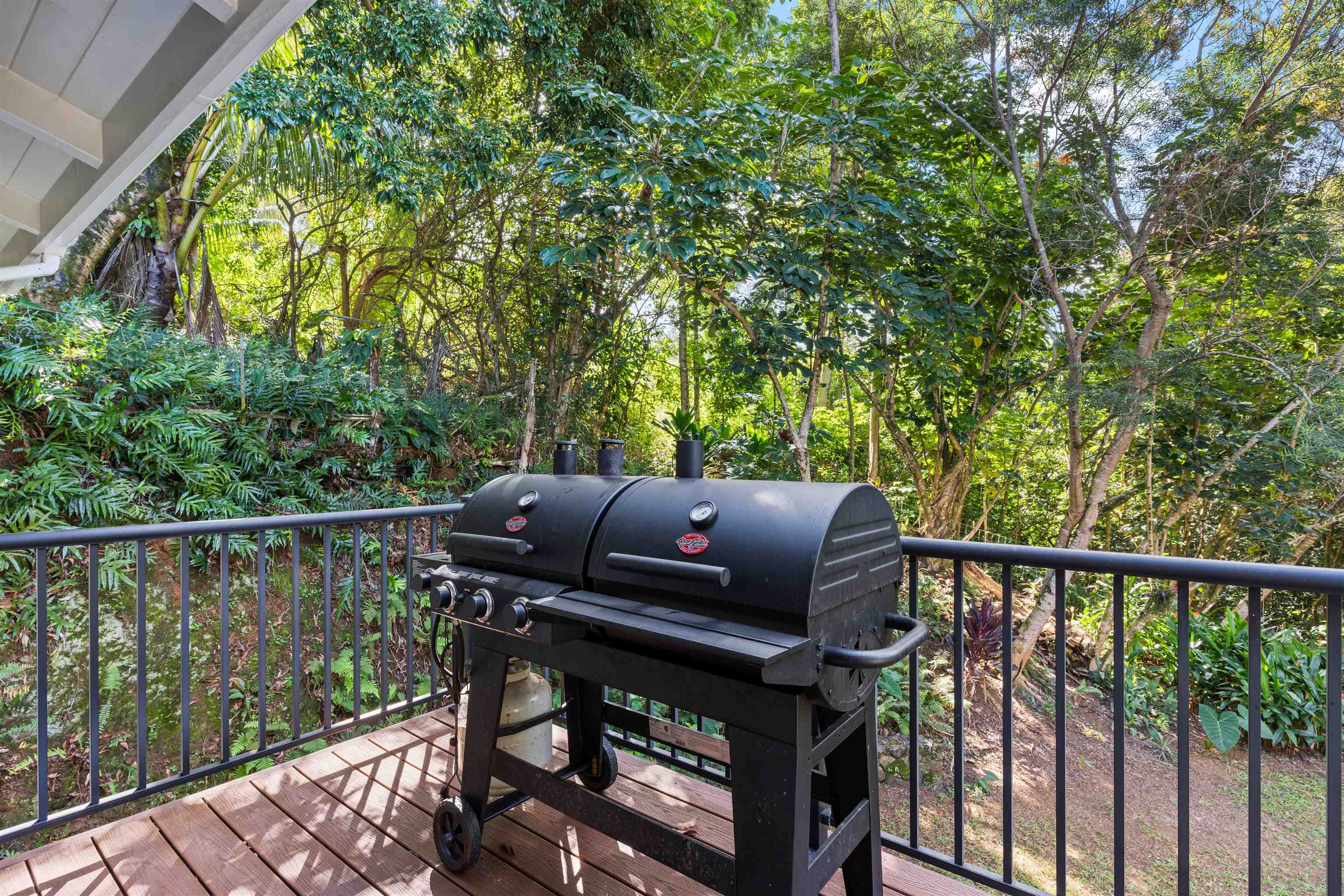655 Kulike Road, Unit B Haiku, HI 96708 - Photo 20 of 38 a view of balcony with wooden floor and outdoor seating