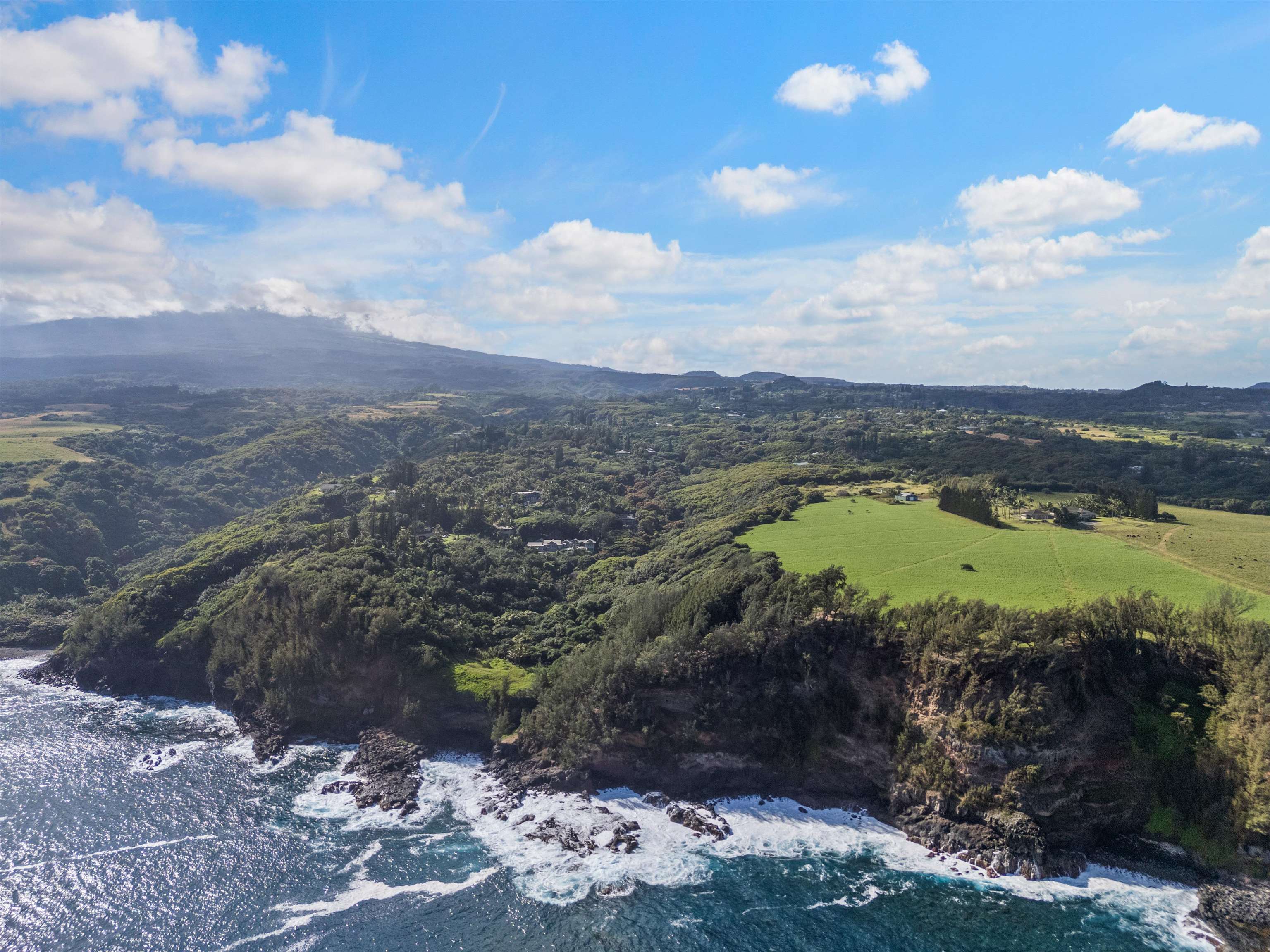 655 Kulike Road, Unit B Haiku, HI 96708 - Photo 2 of 38 a view of a lake with a mountain
