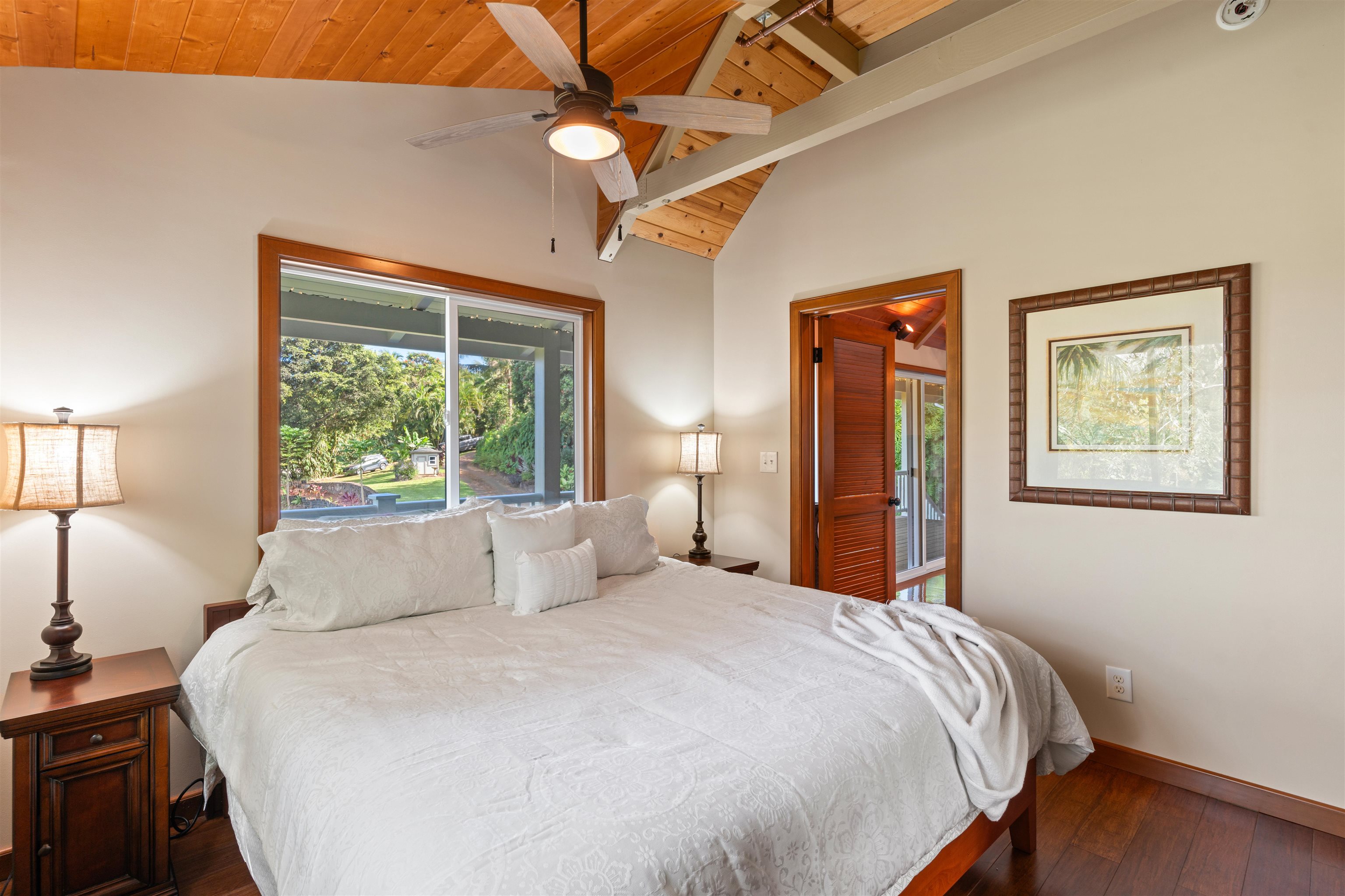 655 Kulike Road, Unit B Haiku, HI 96708 - Photo 21 of 38 a bedroom with a large bed and a window