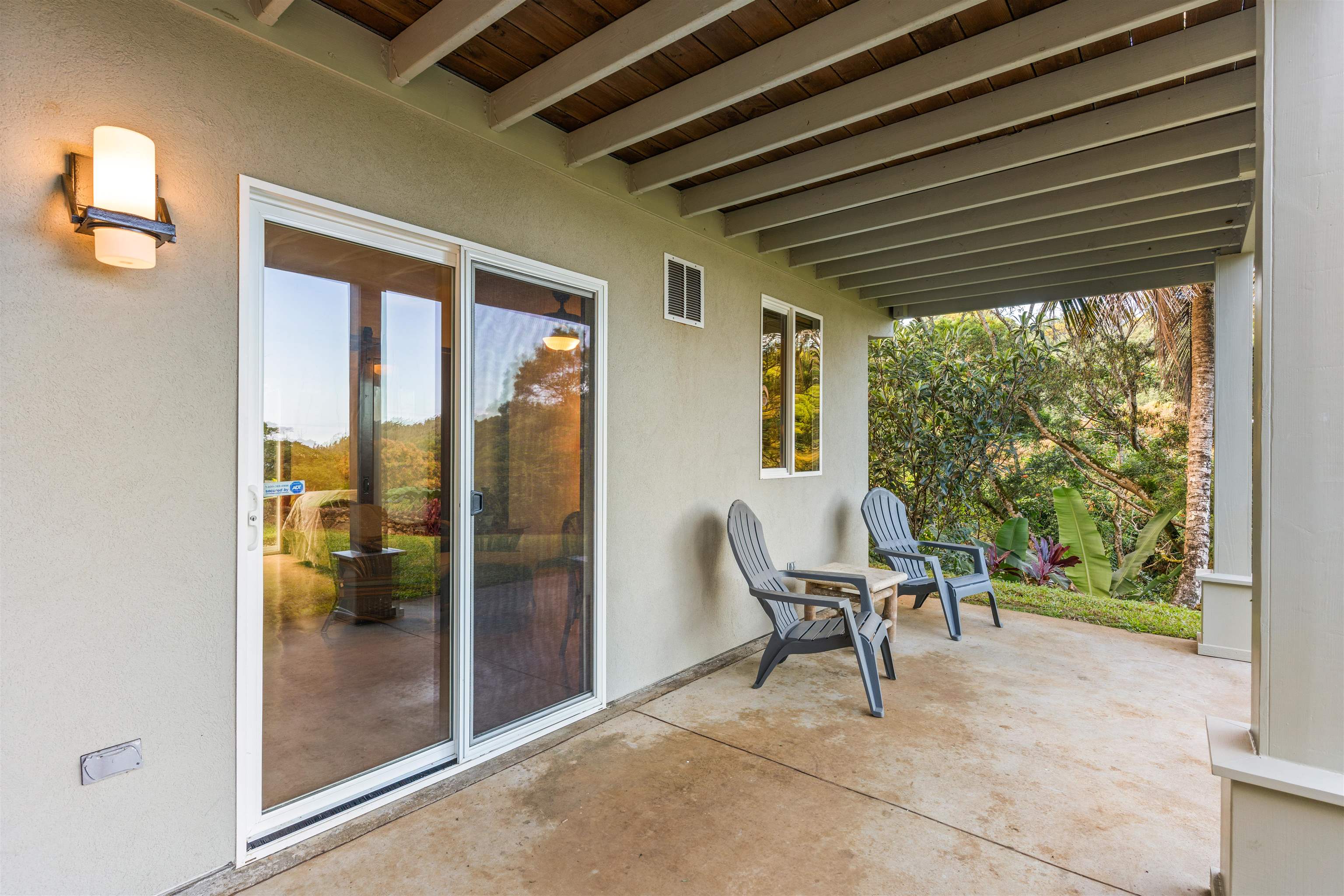 655 Kulike Road, Unit B Haiku, HI 96708 - Photo 31 of 38 a outdoor space with a large window and furniture