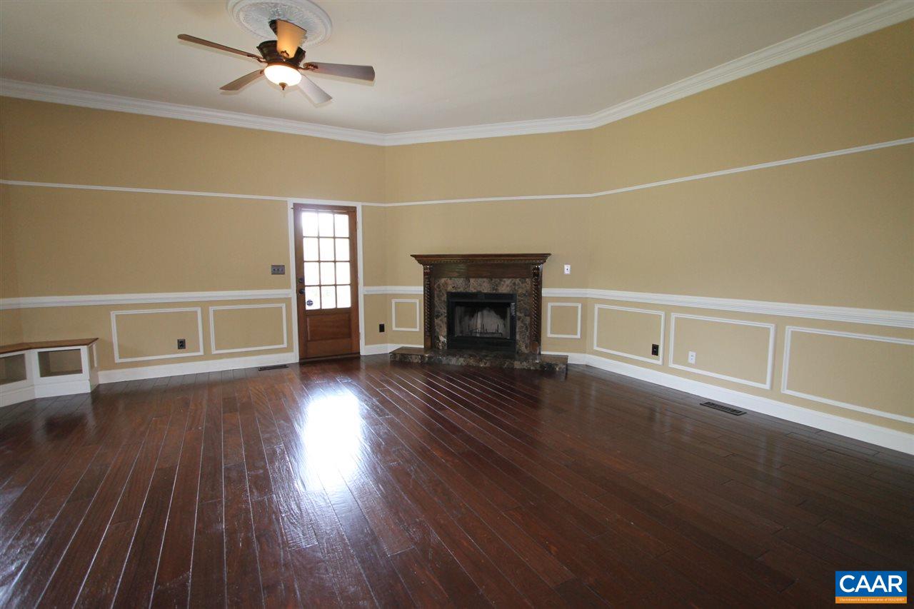 5861 Free Union Road Free Union, VA 22940 - Photo 8 of 48 a view of empty room with wooden floor and fireplace