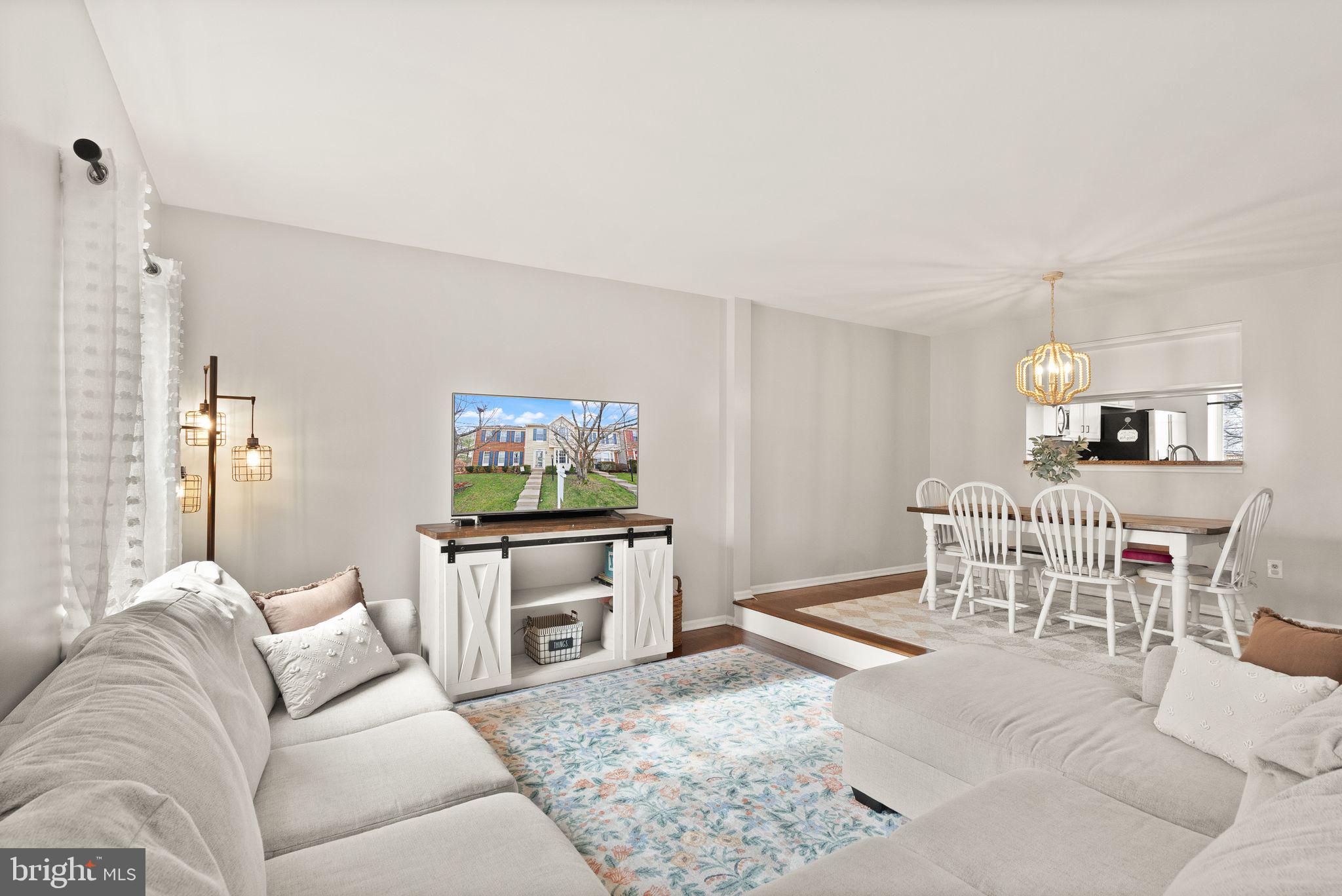 6020 Kestner Circle Alexandria, VA 22315 - Photo 17 of 59 a living room with furniture a flat screen tv and kitchen view