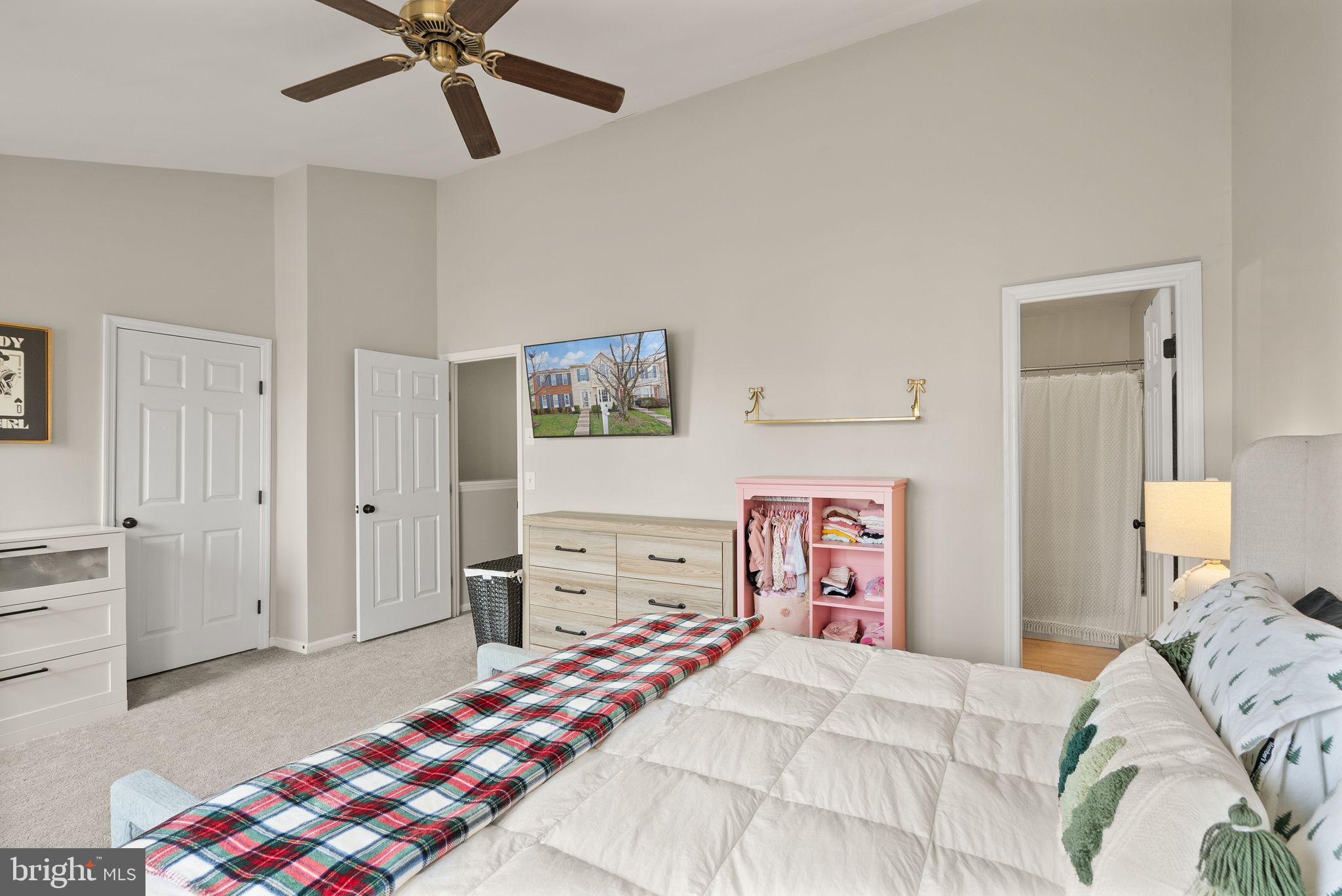 6020 Kestner Circle Alexandria, VA 22315 - Photo 22 of 59 a bedroom with a bed and a chandelier