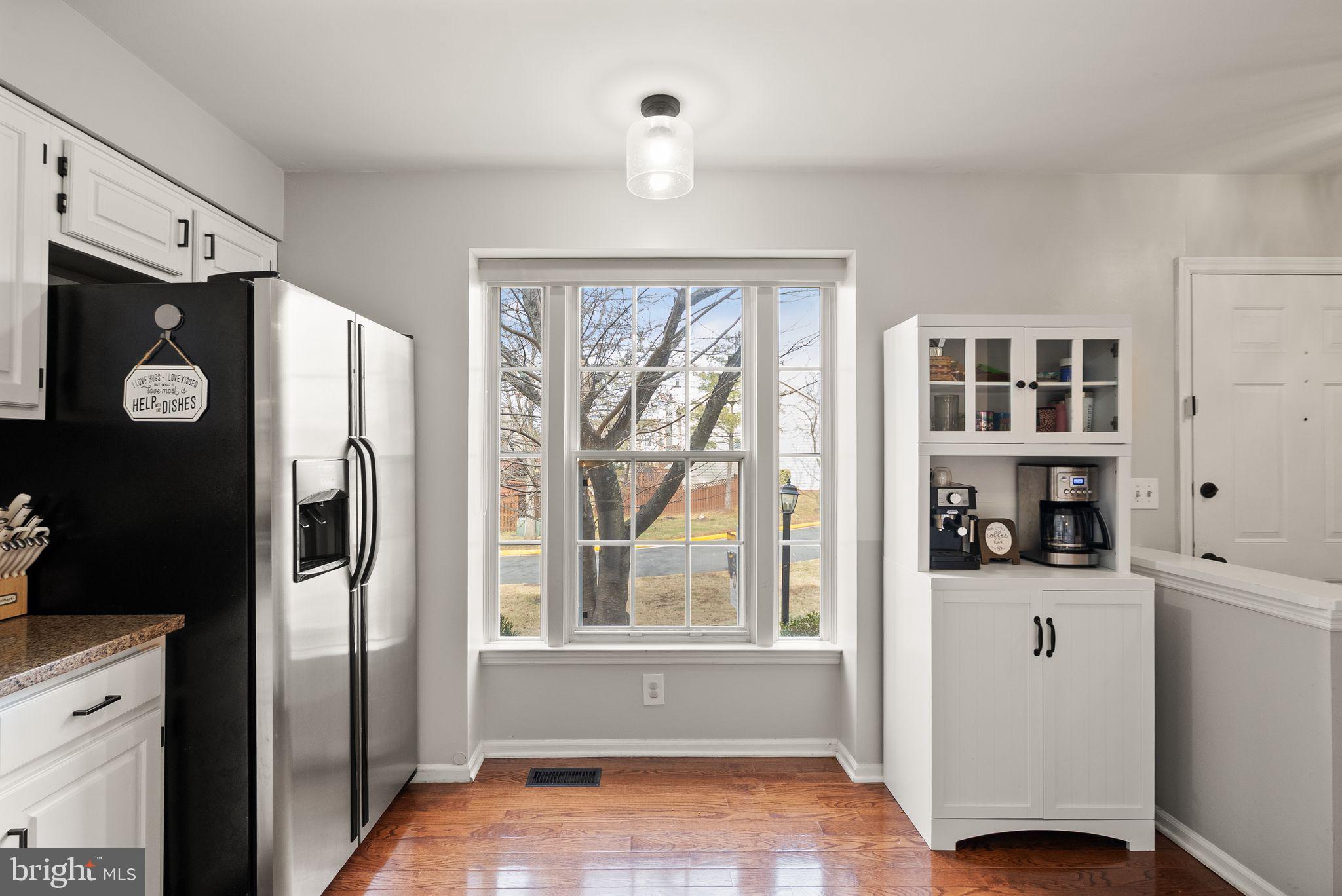6020 Kestner Circle Alexandria, VA 22315 - Photo 5 of 59 a view of kitchen with stainless steel appliances wooden floor and a window