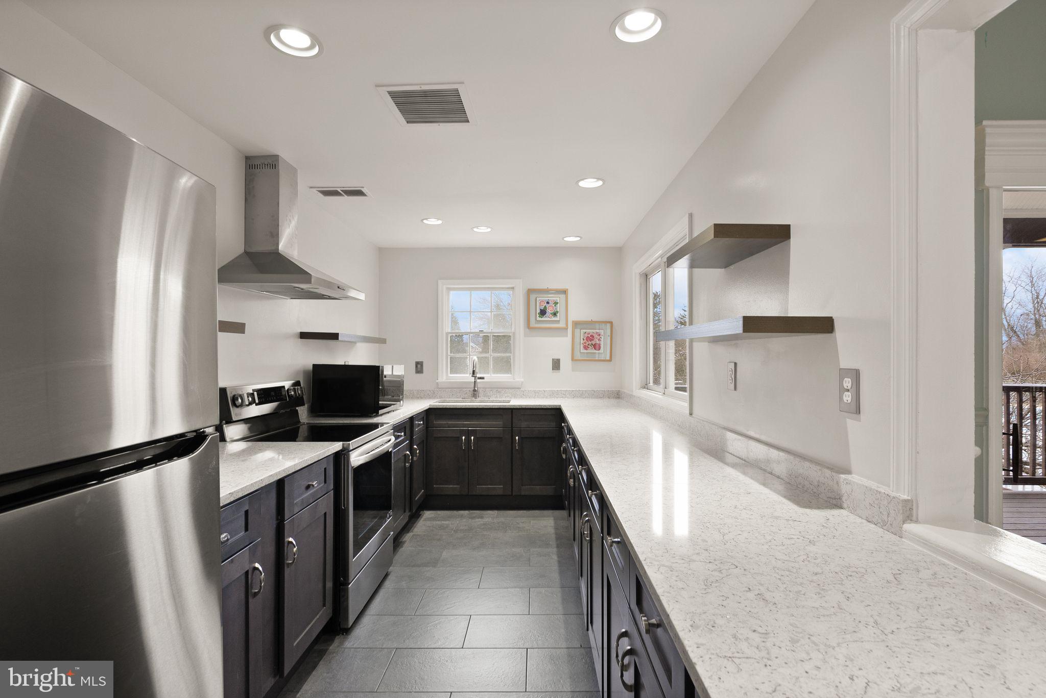 6020 Kestner Circle Alexandria, VA 22315 - Photo 54 of 59 a kitchen with granite countertop a sink stove and refrigerator