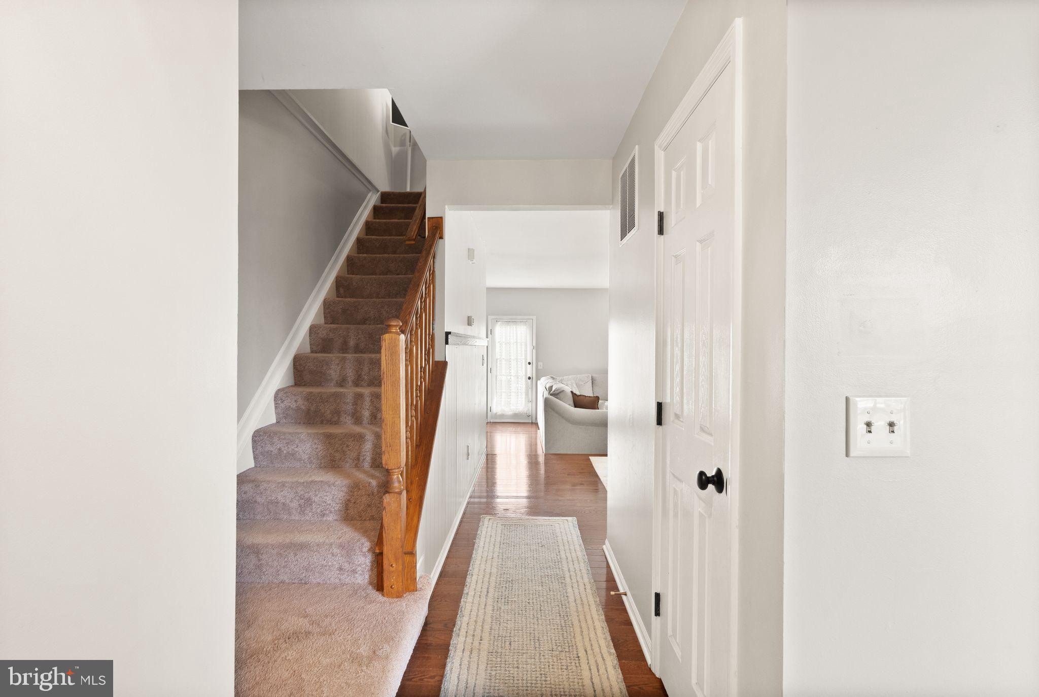 6020 Kestner Circle Alexandria, VA 22315 - Photo 10 of 59 a view of a hallway with wooden floor and staircase