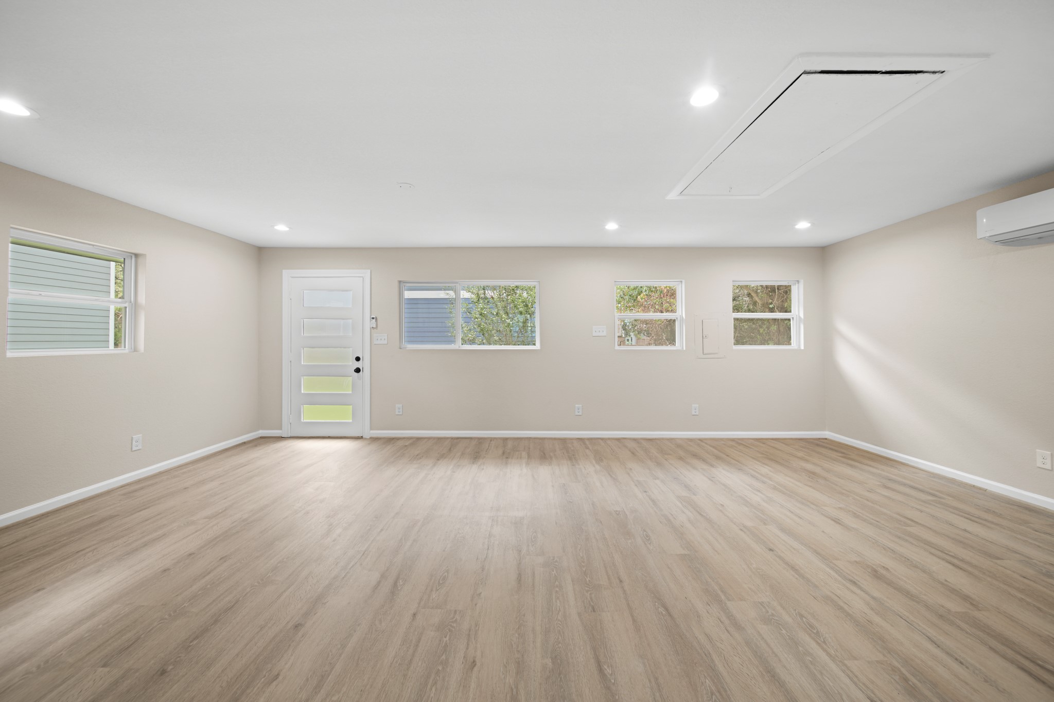 220 Pine Road Clear Lake Shores, TX 77565 - Photo 24 of 31 an empty room with wooden floor and windows