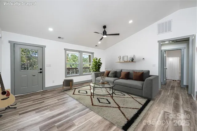a bathroom with a granite countertop toilet a sink and a mirror