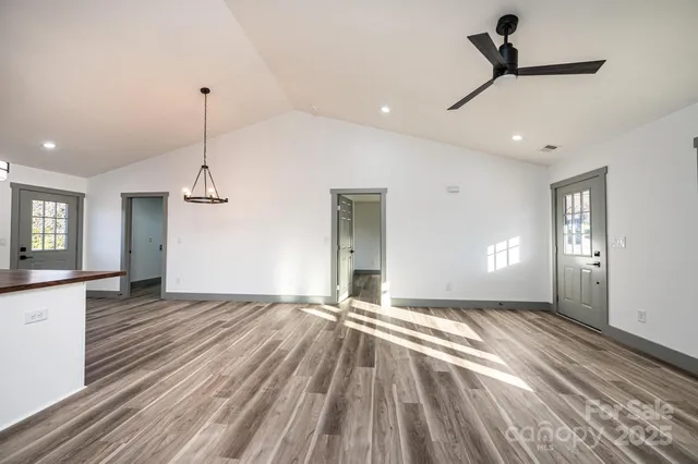 a view of wooden balcony and trees