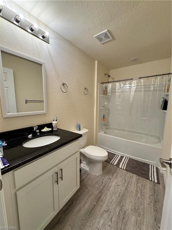 108 Dublin Circle LaBelle, FL 33935 - Photo 5 of 12 a bathroom with a granite countertop sink toilet and shower