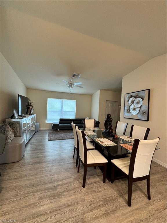 108 Dublin Circle LaBelle, FL 33935 - Photo 8 of 12 a living room with furniture and a wooden floor
