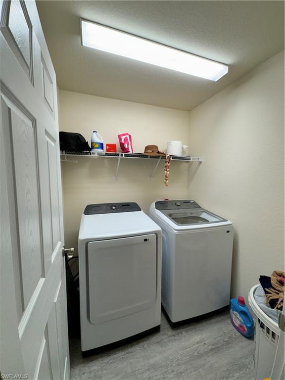 108 Dublin Circle LaBelle, FL 33935 - Photo 9 of 12 a utility room with dryer and washer