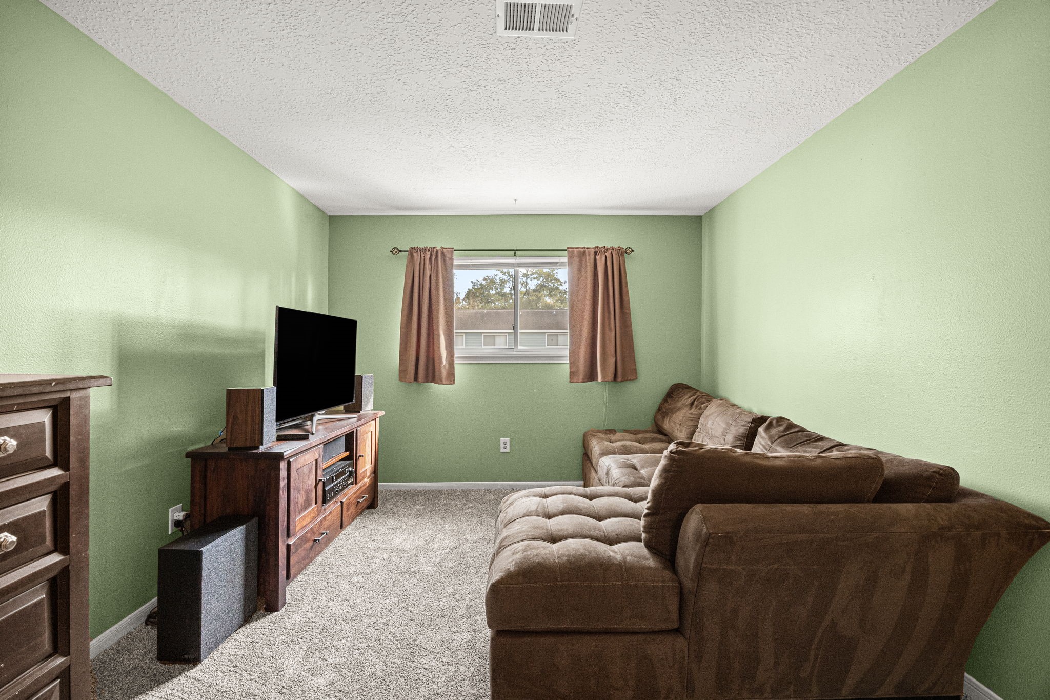 7023 Rosebrook Circle Spring, TX 77379 - Photo 15 of 29 a living room with furniture and a flat screen tv