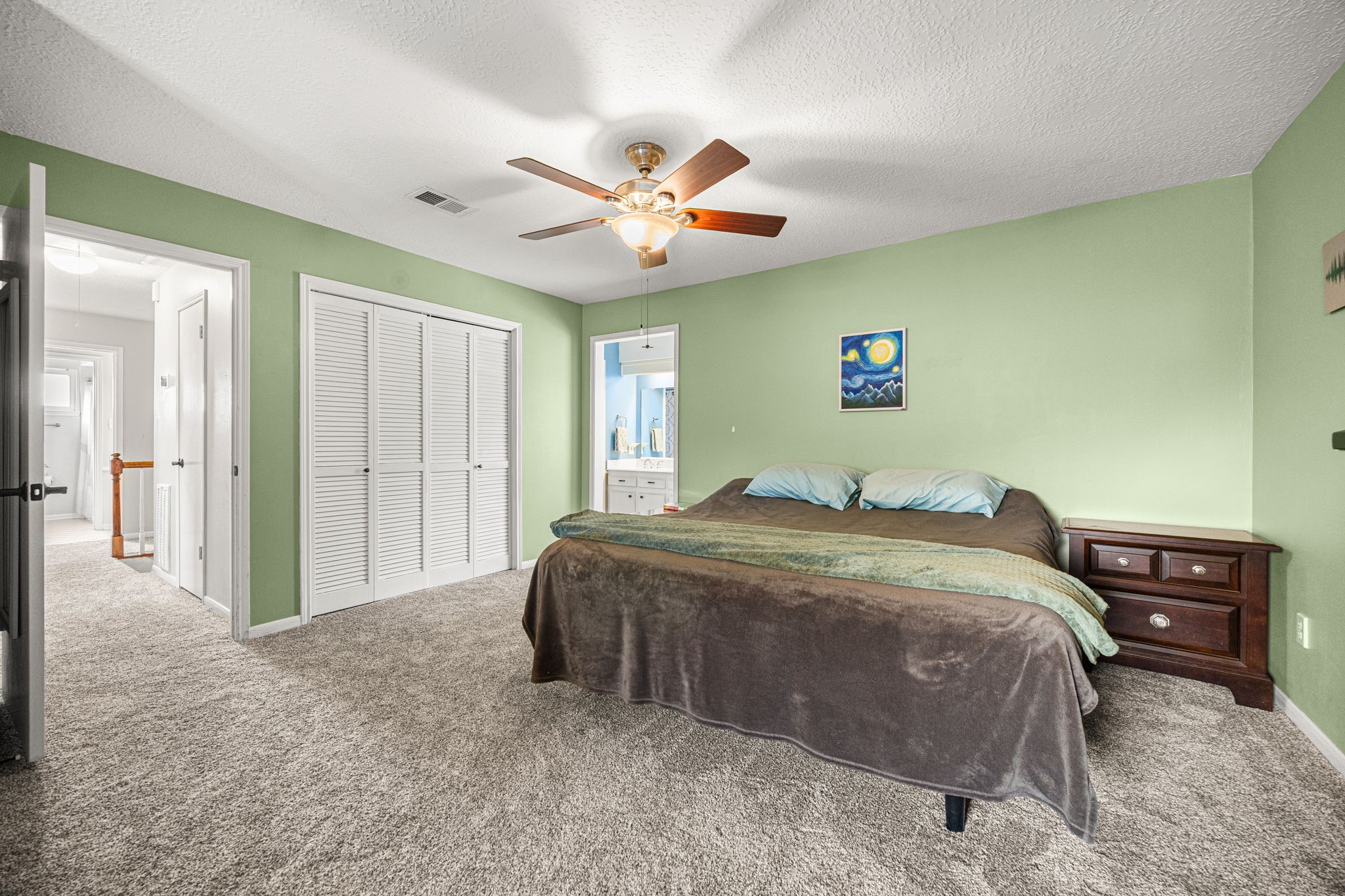 7023 Rosebrook Circle Spring, TX 77379 - Photo 16 of 29 a bedroom with a large bed and a chandelier