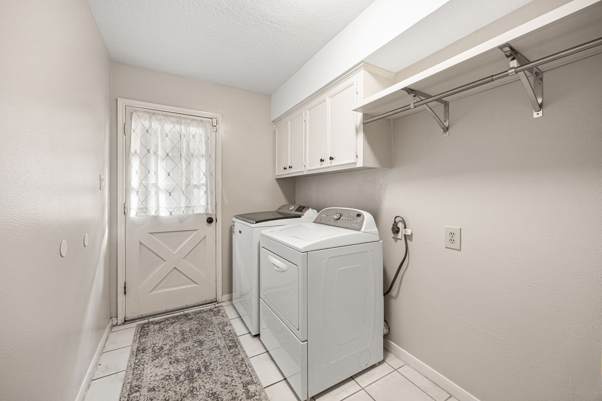 7023 Rosebrook Circle Spring, TX 77379 - Photo 23 of 29 a utility room with dryer and washer