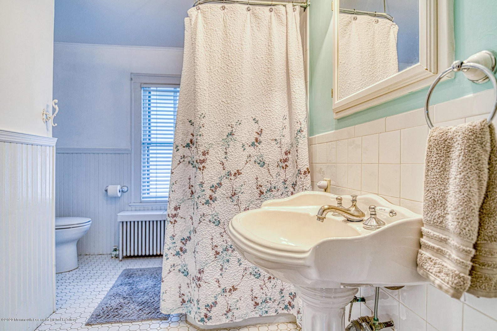 124 Main Avenue Ocean Grove, NJ 07756 - Photo 22 of 22 a bathroom with a sink and a mirror