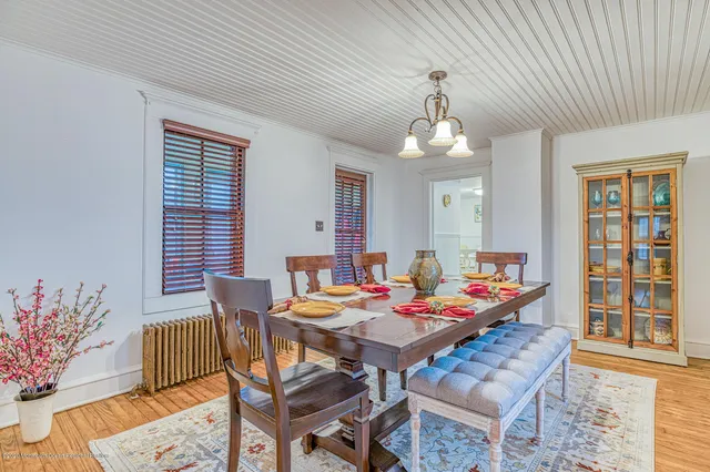 a view of a dining room with furniture and window