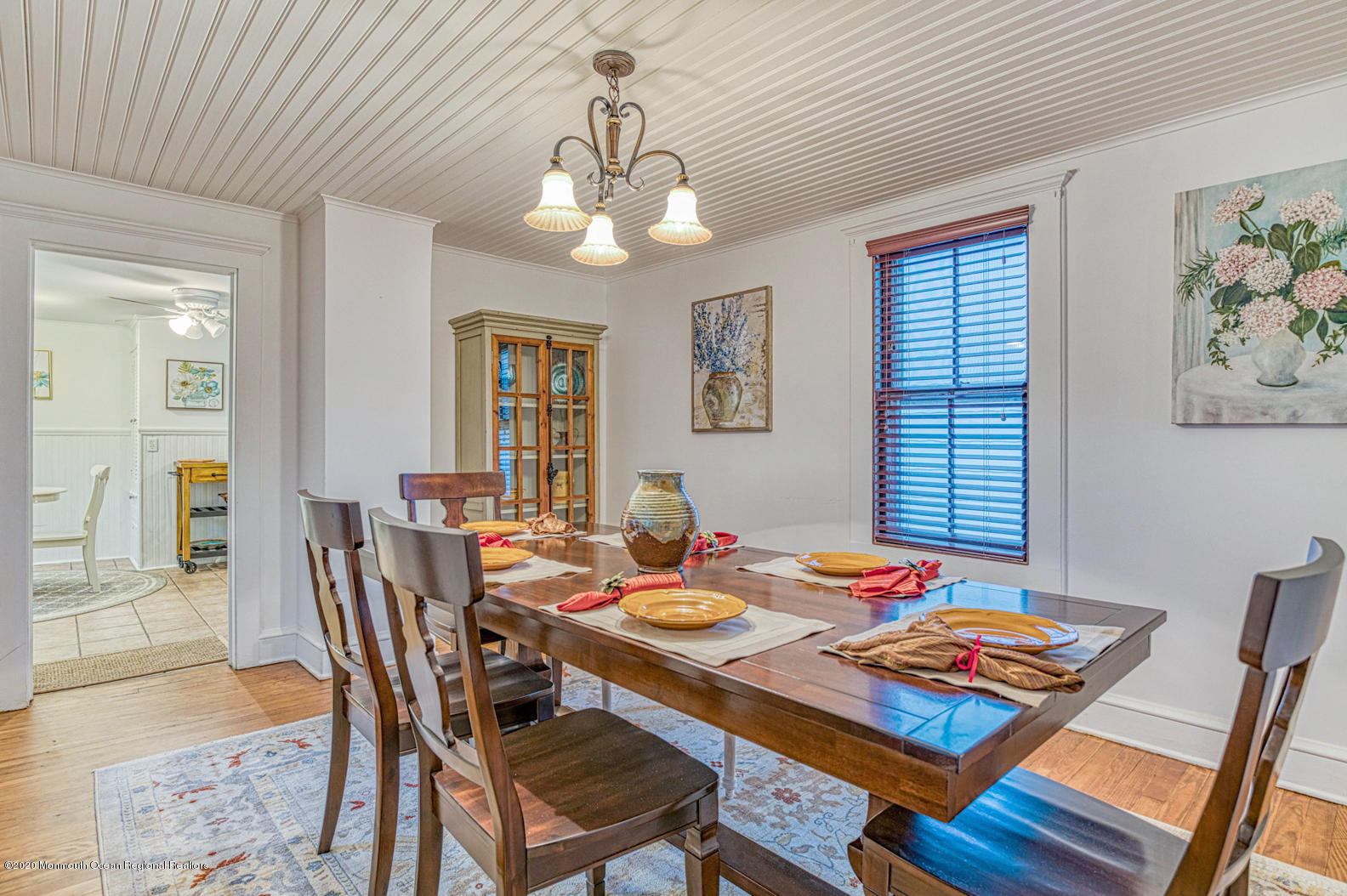 124 Main Avenue Ocean Grove, NJ 07756 - Photo 10 of 22 a view of a dining room with furniture a chandelier and wooden floor