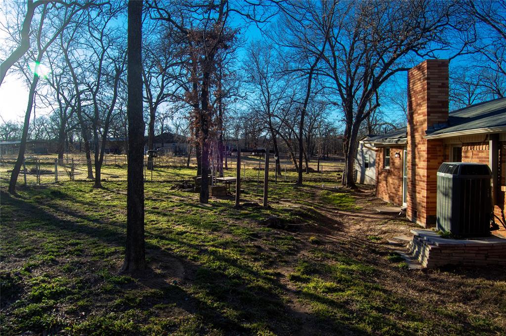 1938 Spring Drive Keller, TX 76262 - Photo 3 of 16 a view of a park with large trees