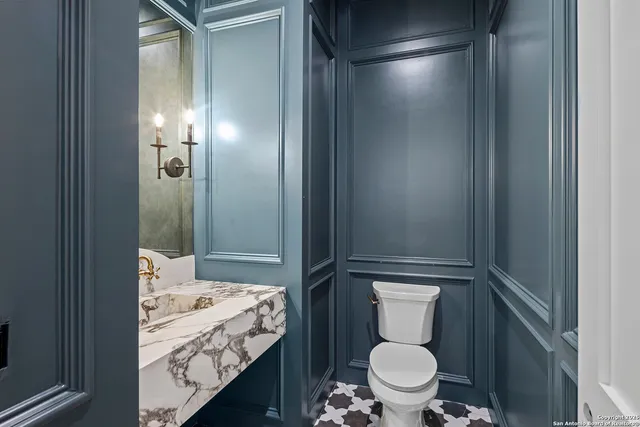 a bathroom with a sink and toilet